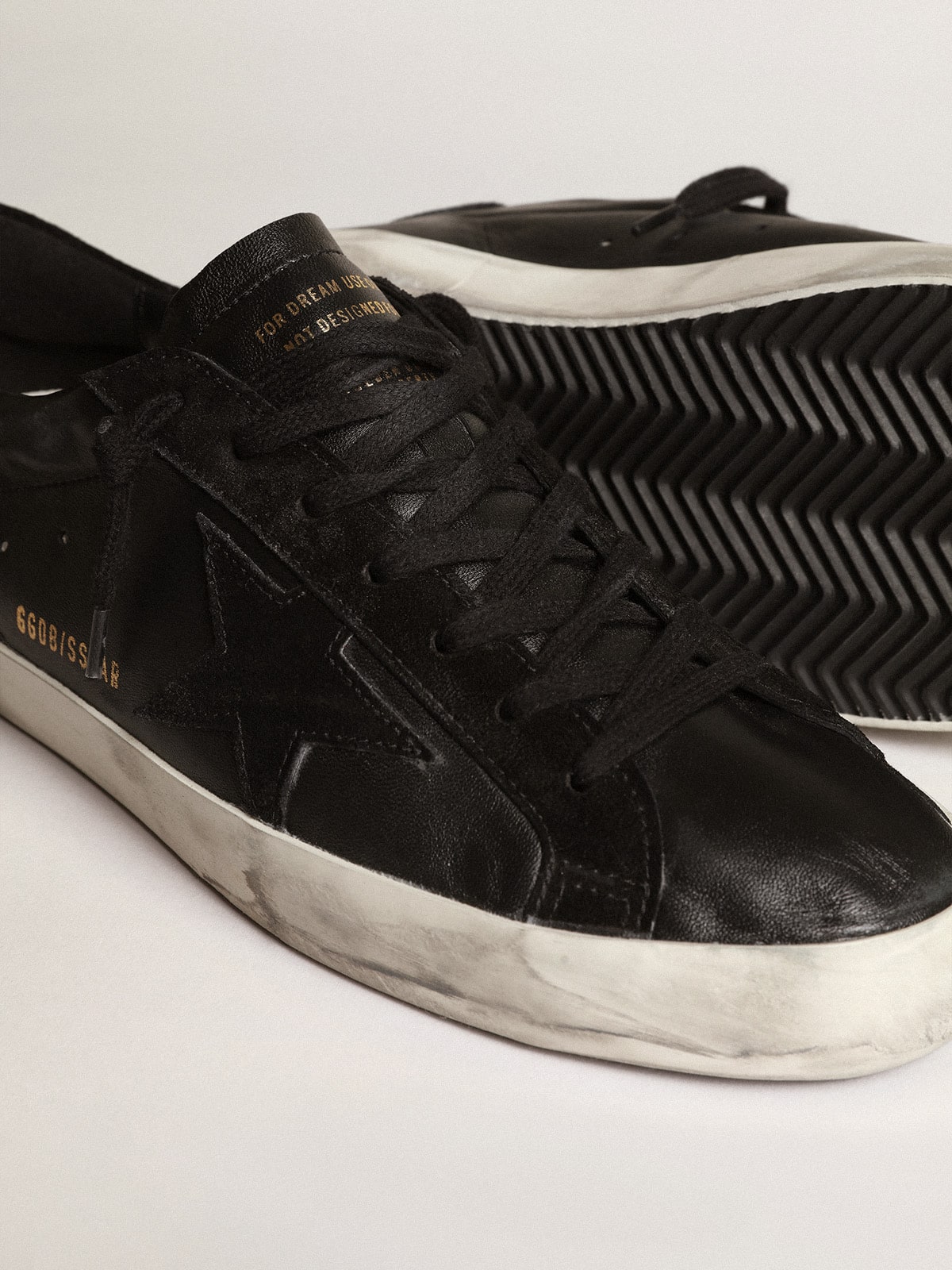 Men's Super-Star in black nappa with black suede star and heel tab
