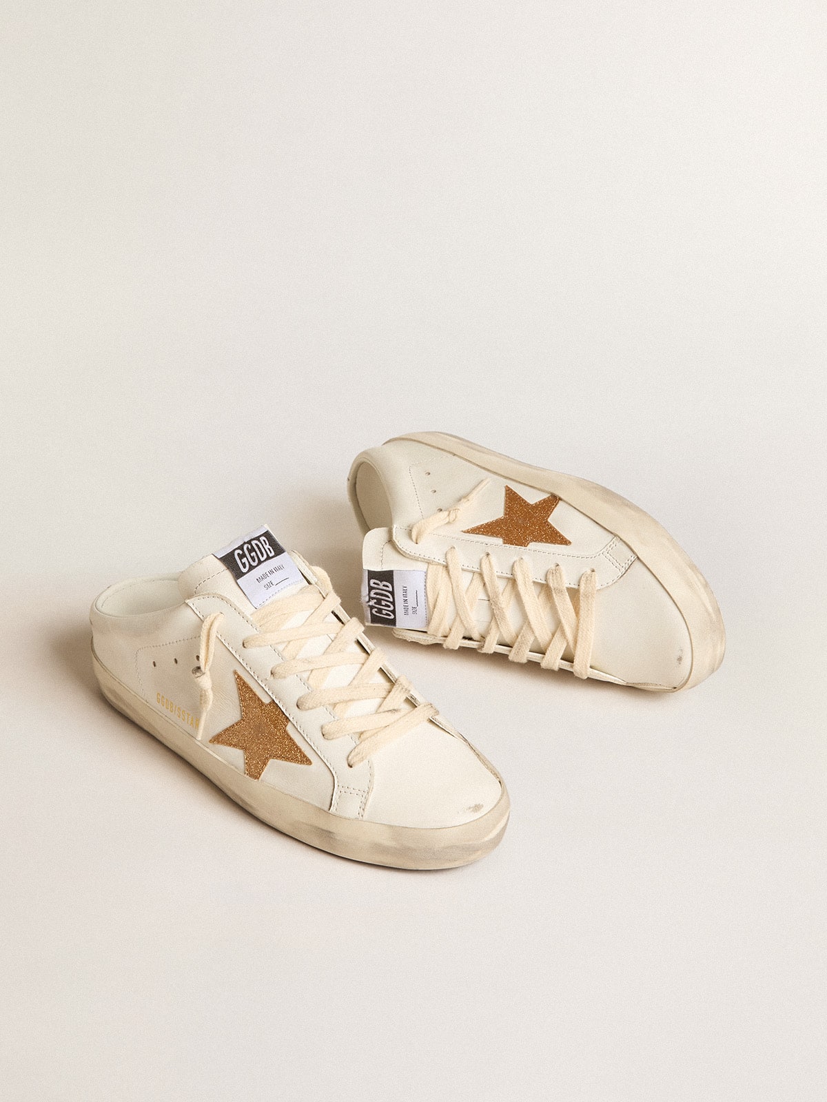 Super-Star Sabots in leather with plasticized gold glitter star