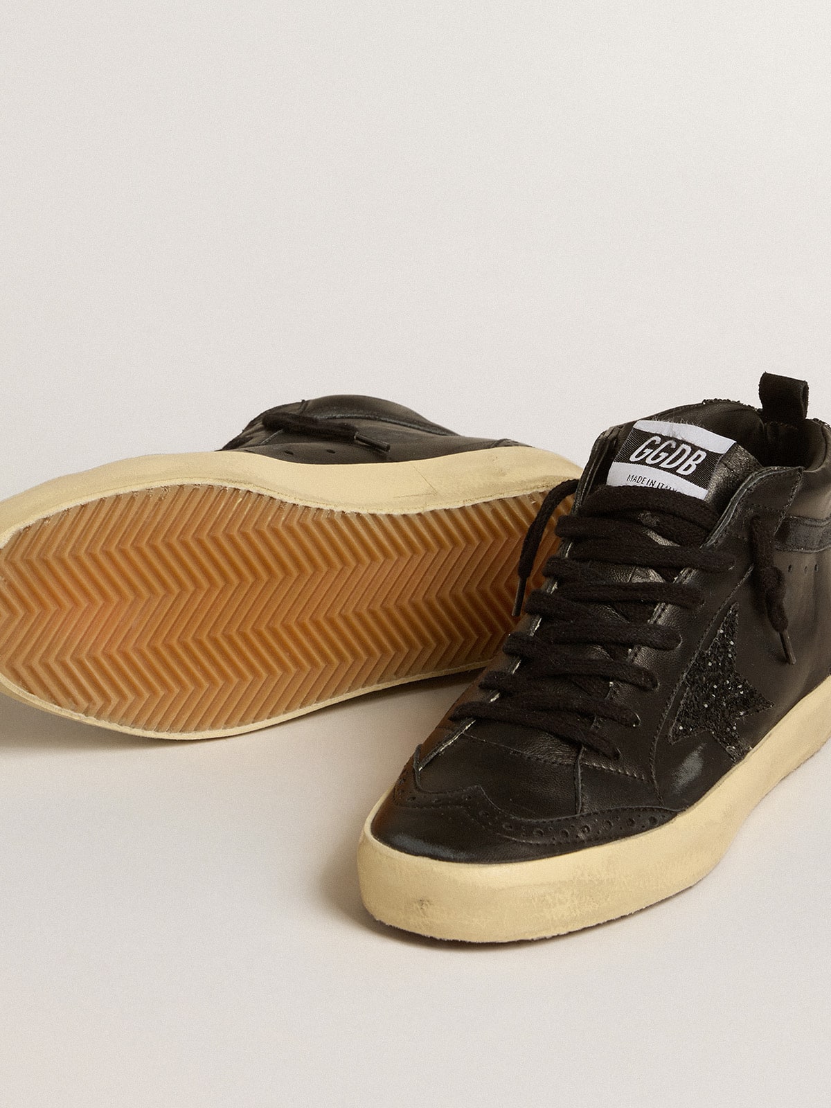Women's Mid Star in black nappa with black glitter star and suede flash